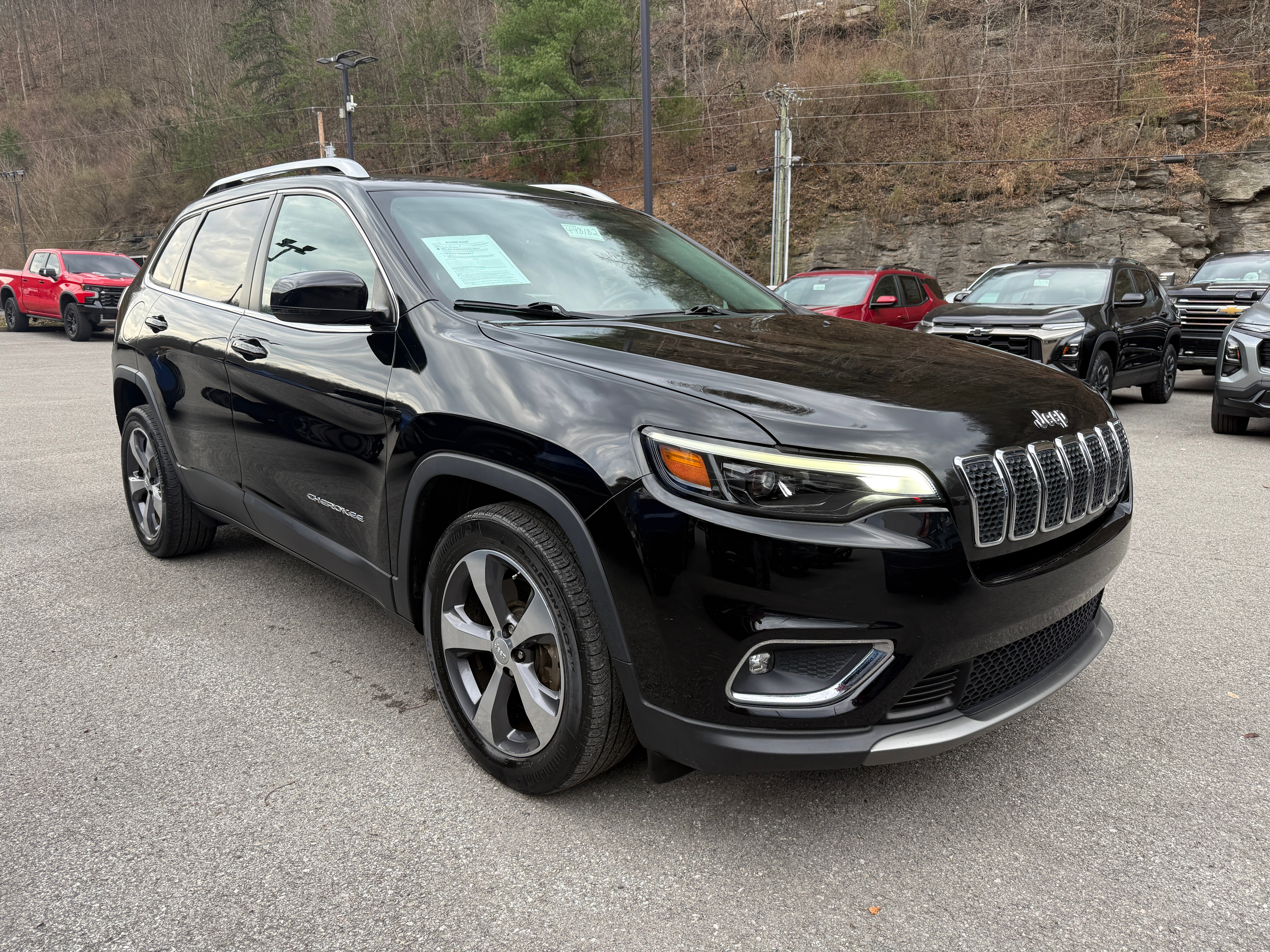 2019 Jeep Cherokee Limited in Black — front three-quarter view