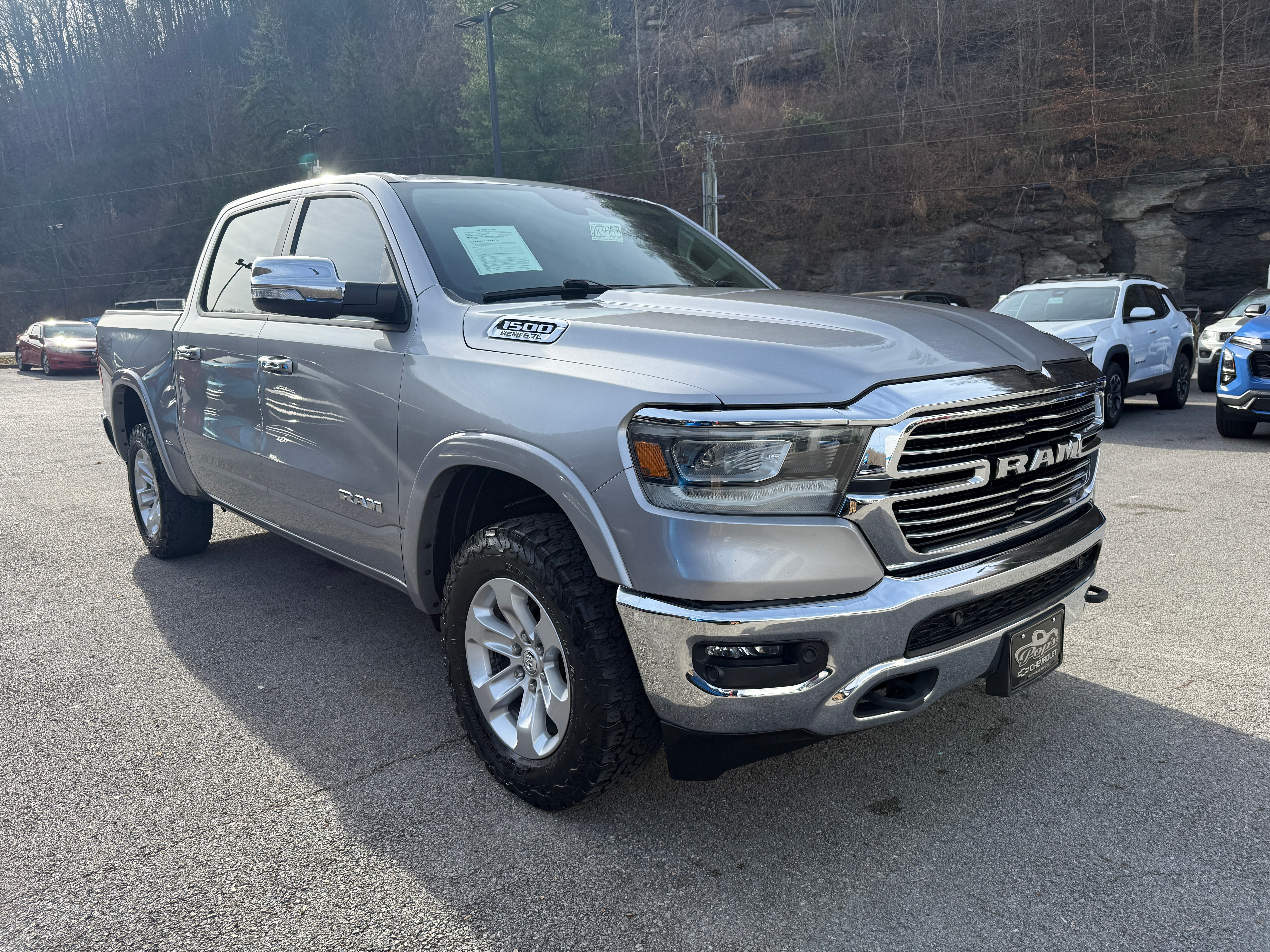 2022 RAM 1500 Laramie in Gray — front three-quarter view