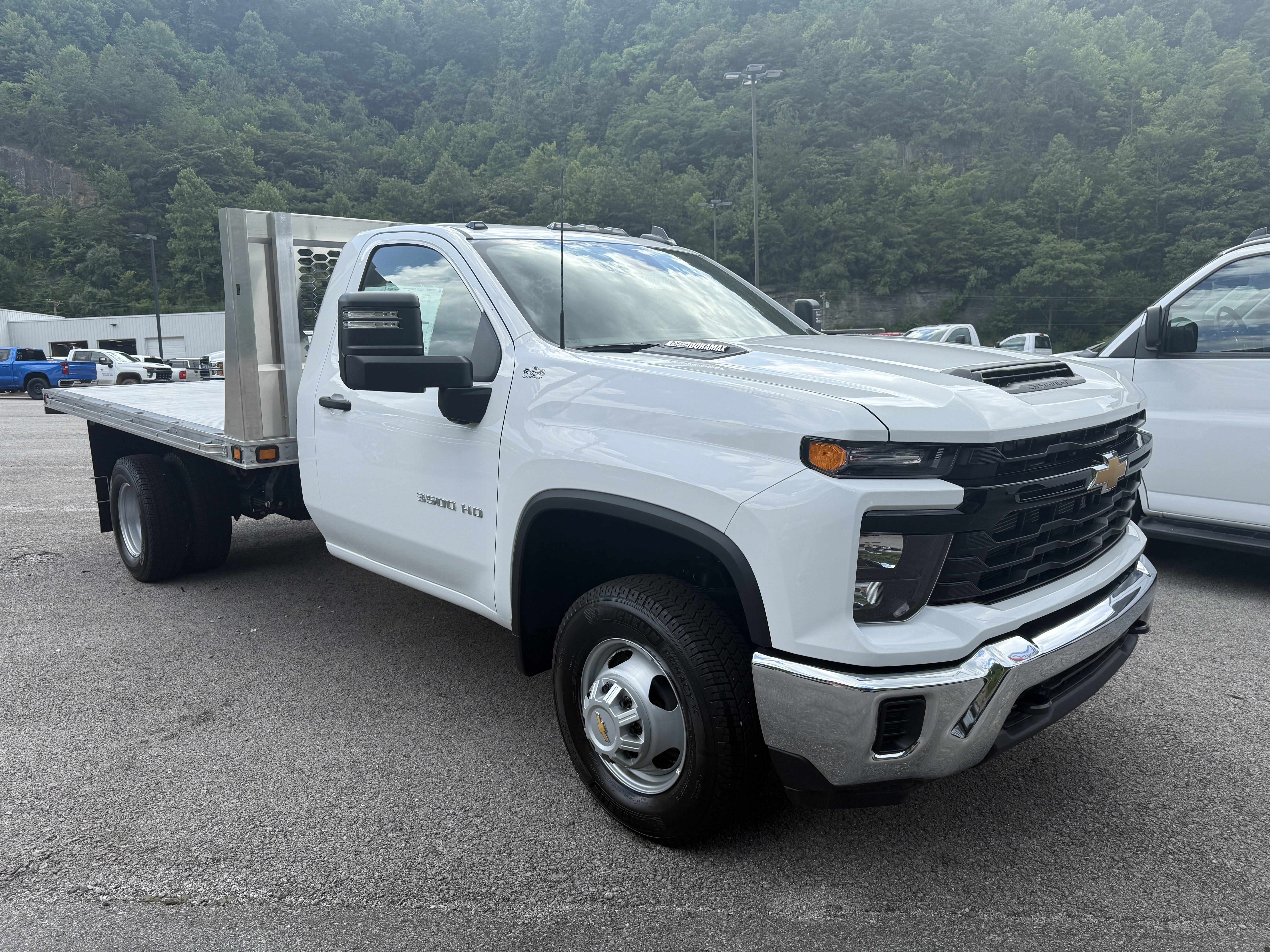 2025 Chevrolet Silverado 3500 HD Chassis Cab Work Truck in Summit White — front three-quarter view