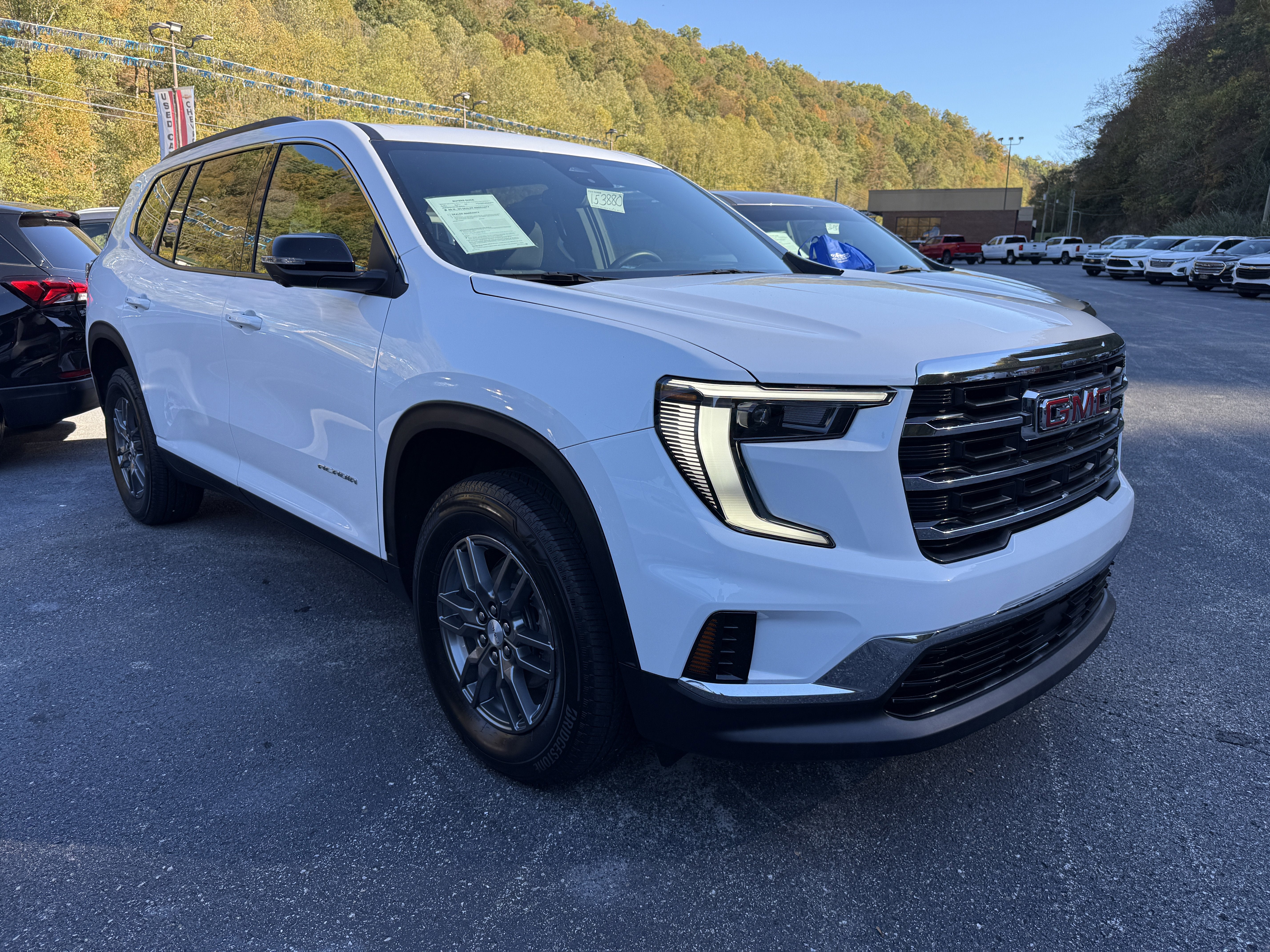 2025 GMC Acadia Elevation in Summit White — front three-quarter view