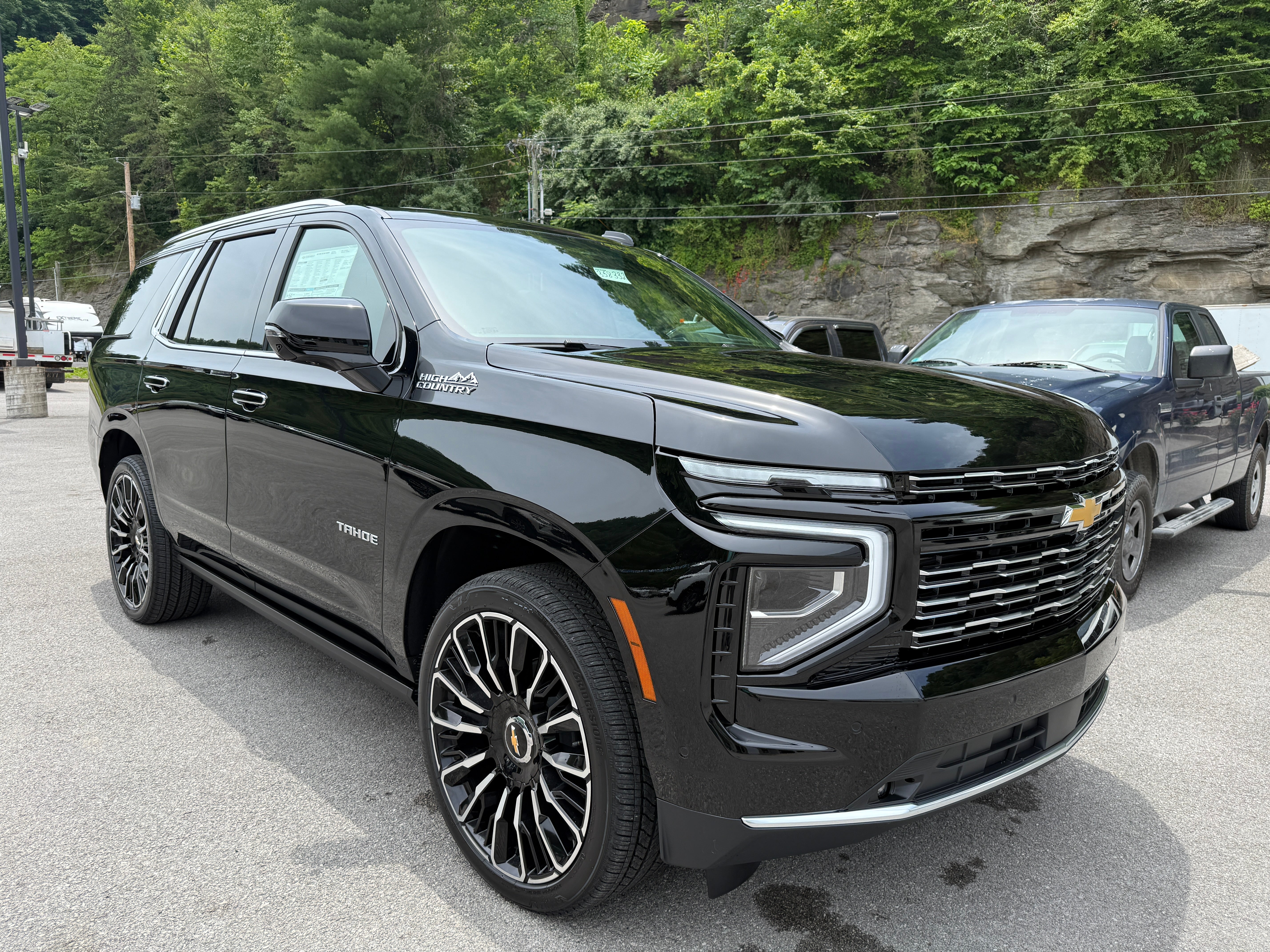 2026 Chevrolet Tahoe High Country in Black — front three-quarter view
