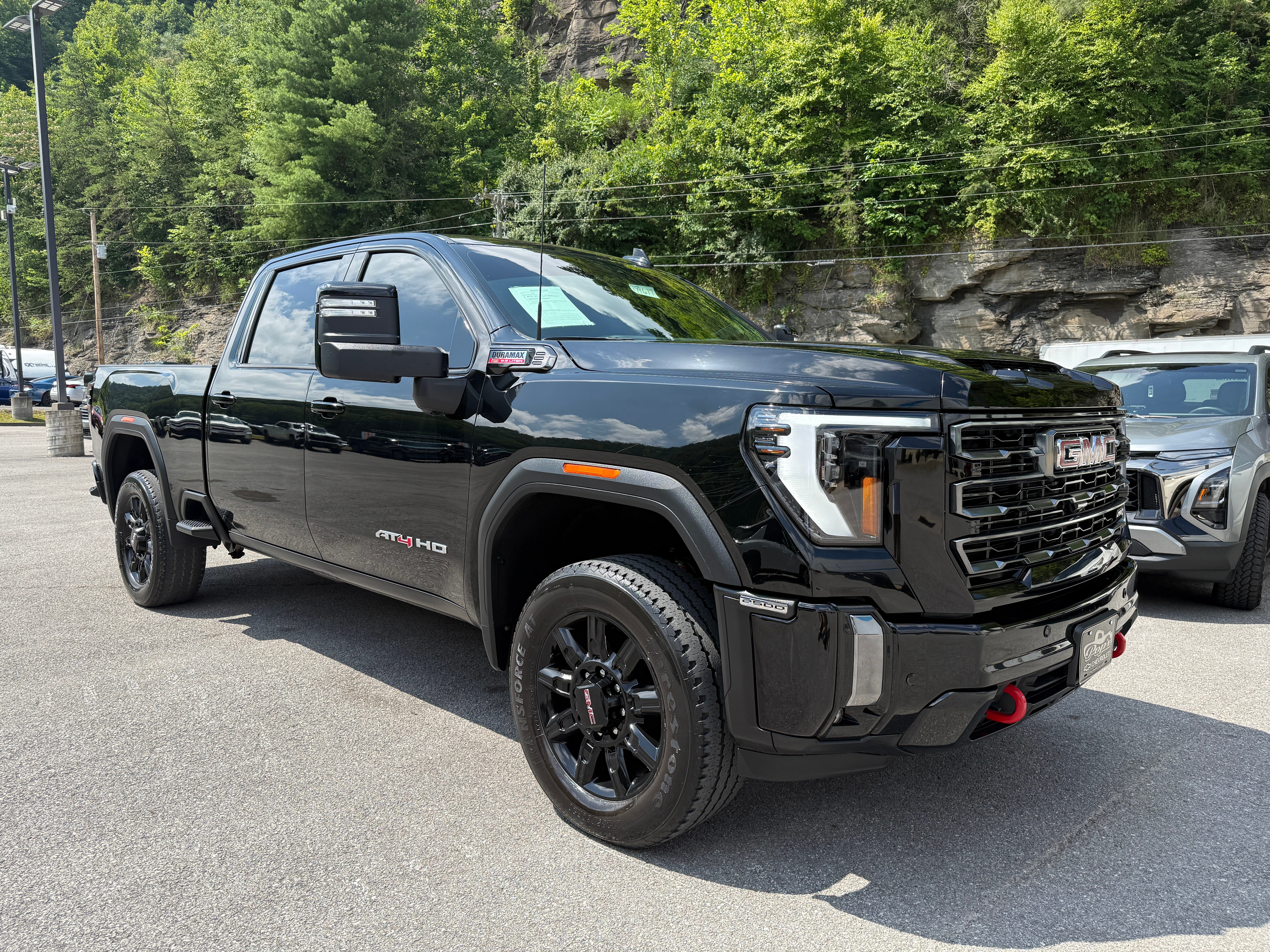 2024 GMC Sierra 2500 HD AT4 in Onyx Black — front three-quarter view