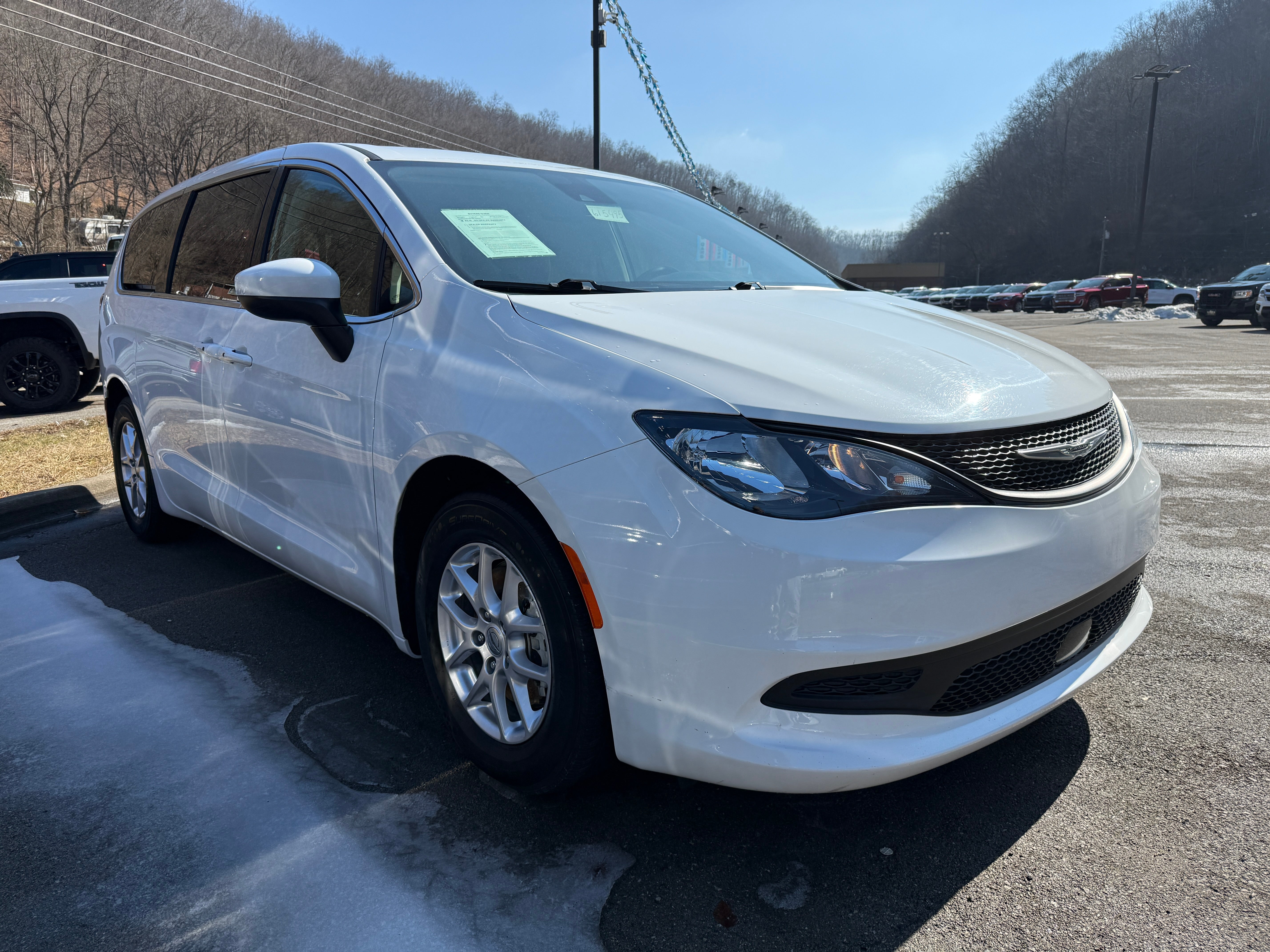 2023 Chrysler Voyager LX in White — front three-quarter view