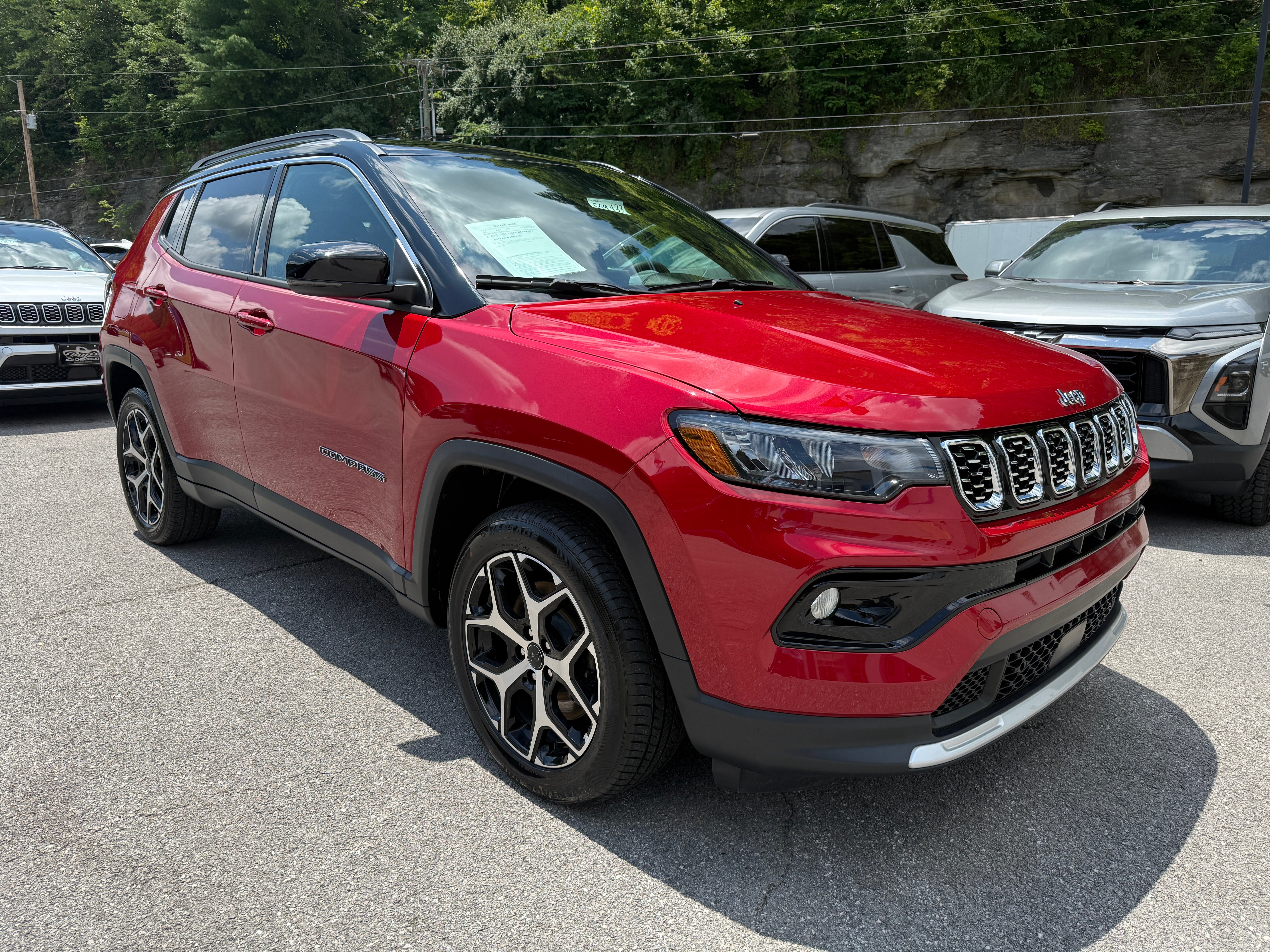 2025 Jeep Compass Limited in Red — front three-quarter view