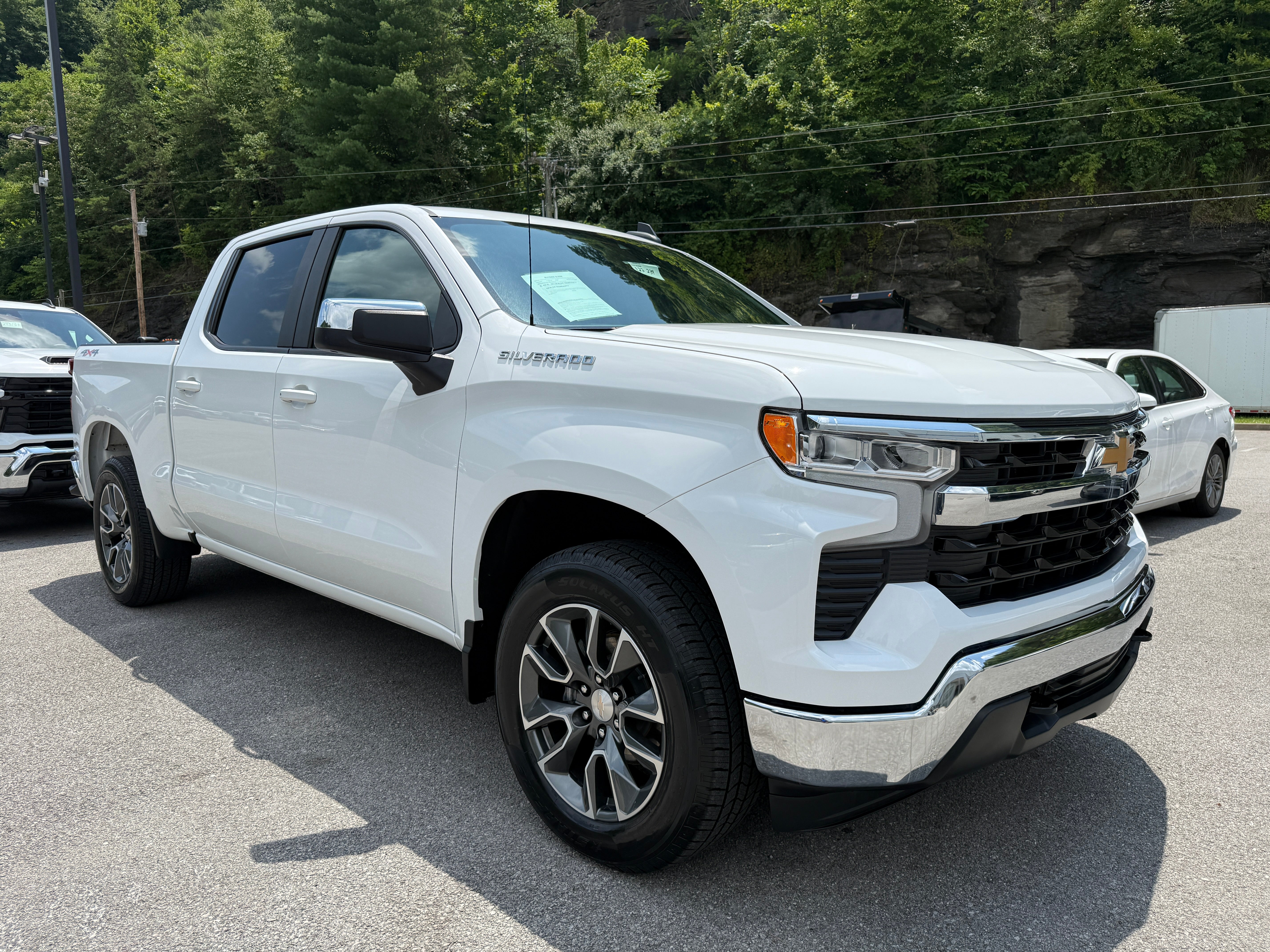 2024 Chevrolet Silverado 1500 LT (2FL) in Summit White — front three-quarter view