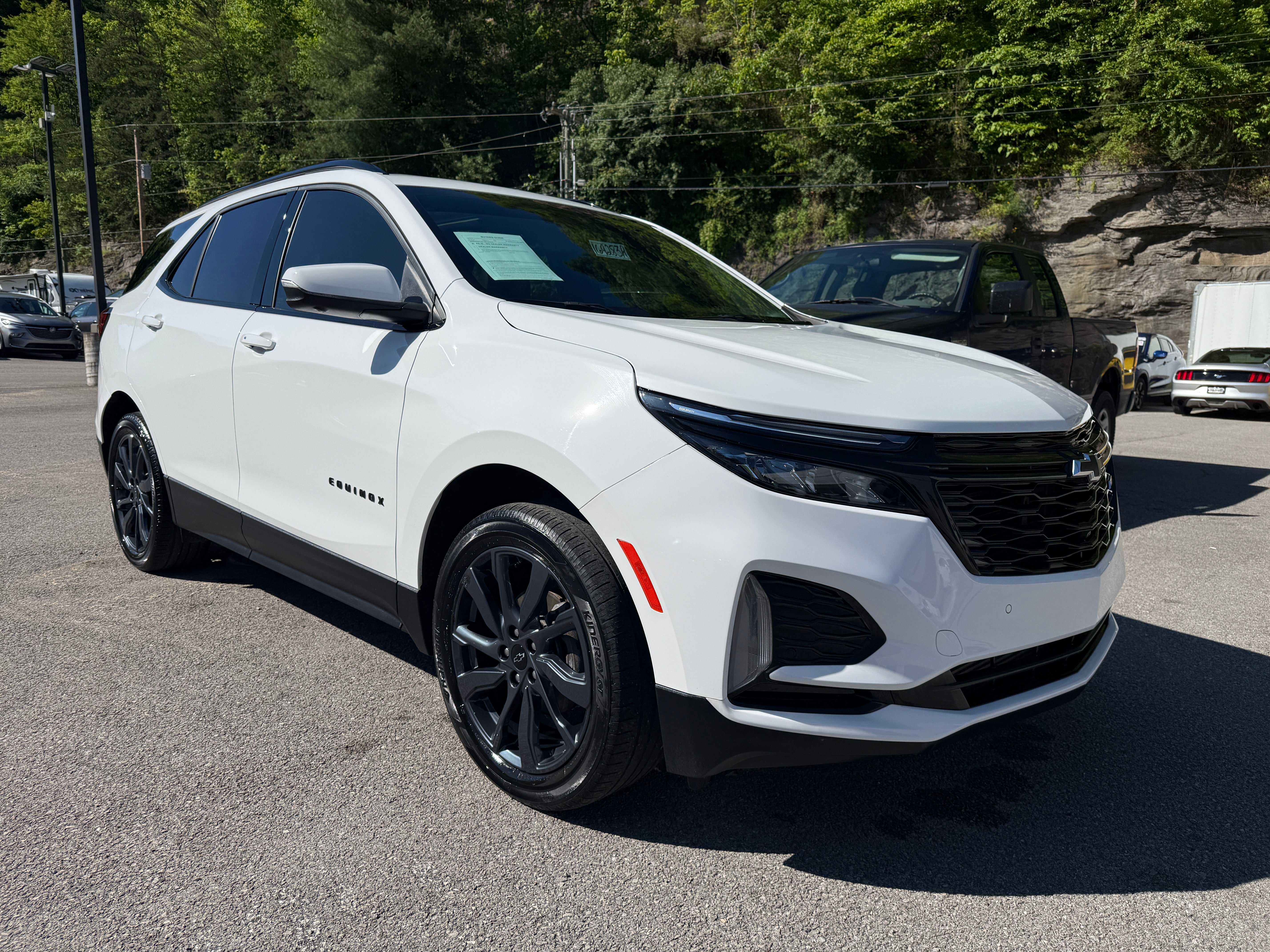 2024 Chevrolet Equinox RS in Summit White — front three-quarter view
