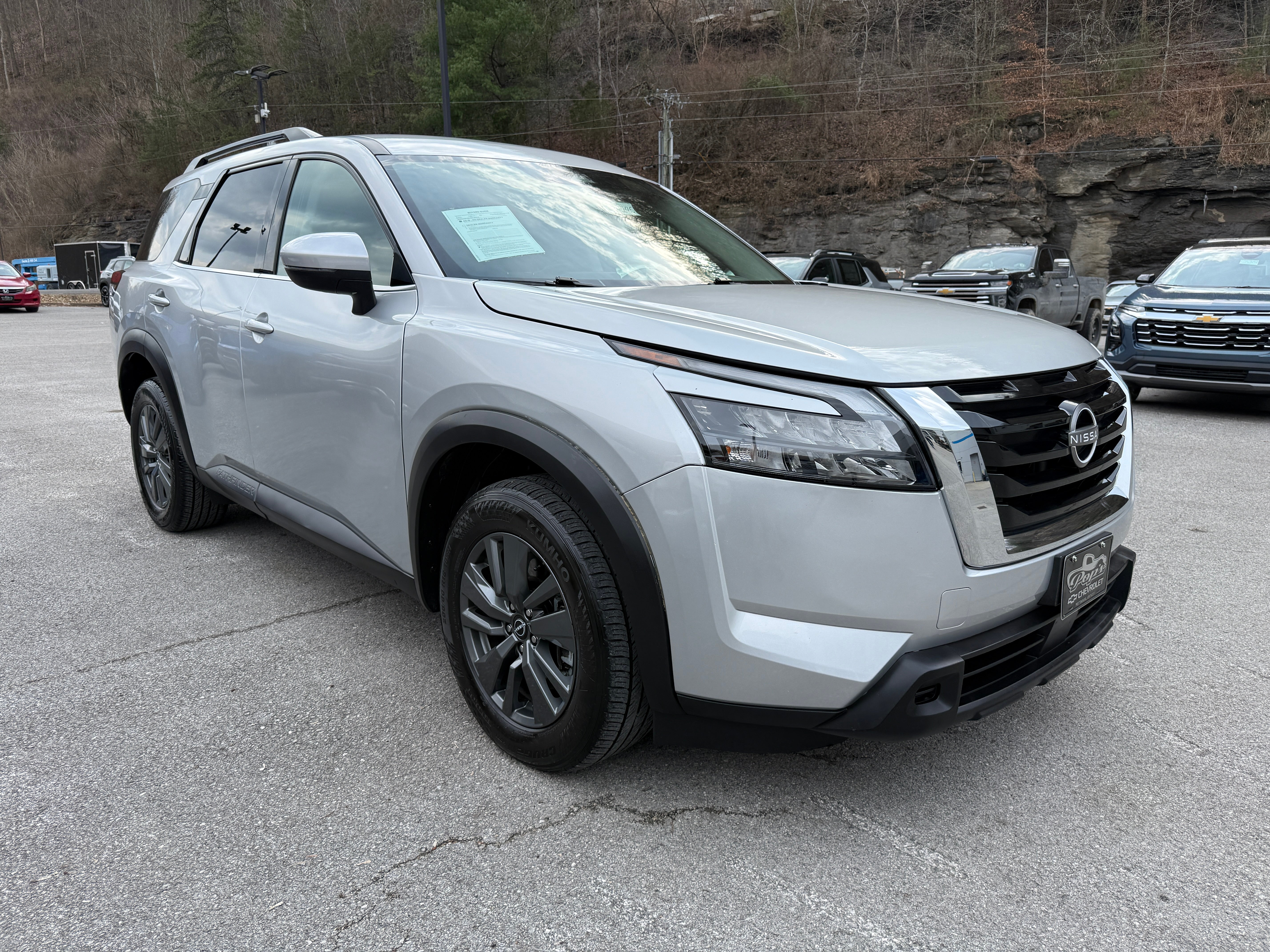 2024 Nissan Pathfinder SV in Silver — front three-quarter view