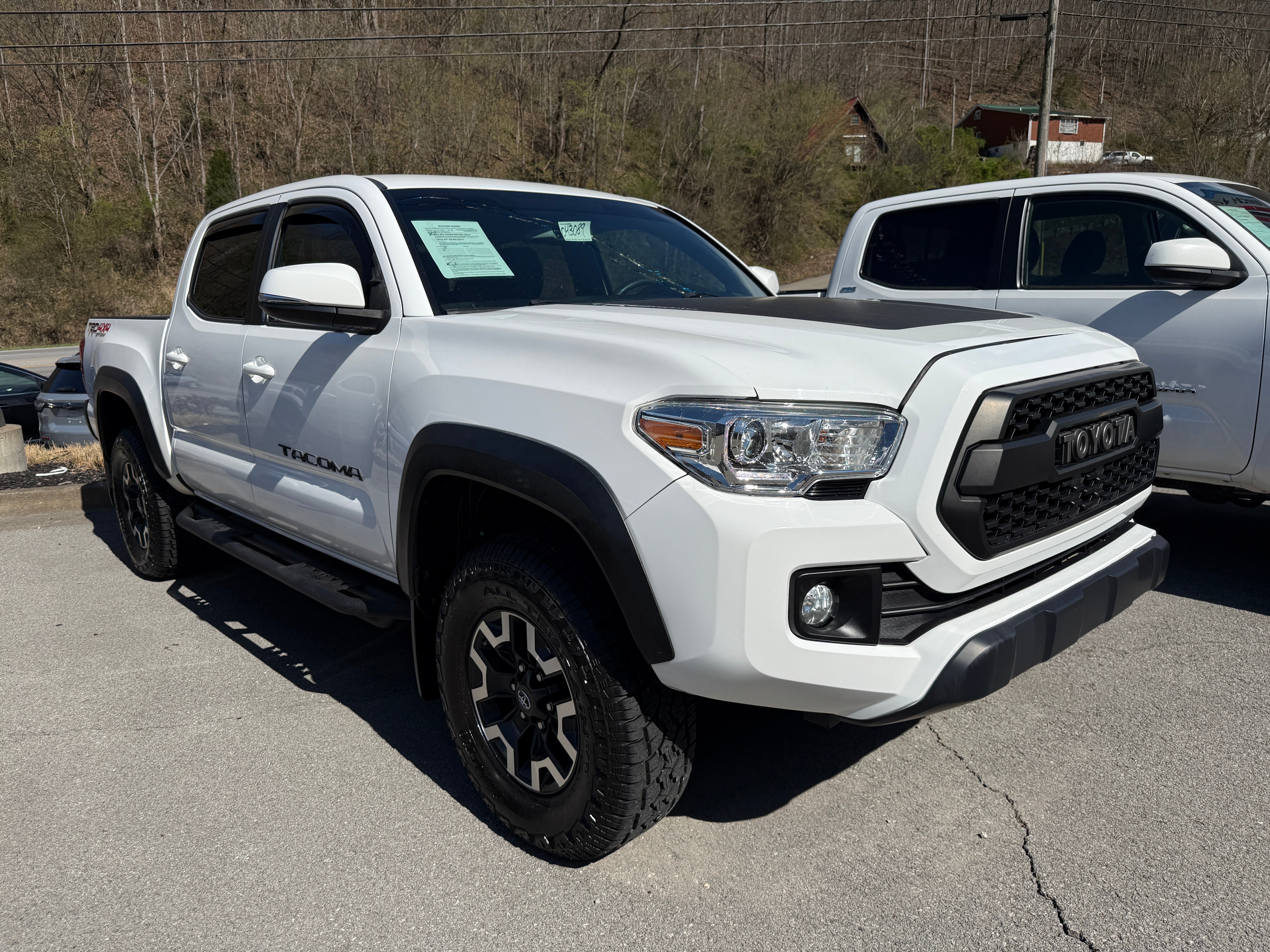 2016 Toyota Tacoma SR in White — front three-quarter view