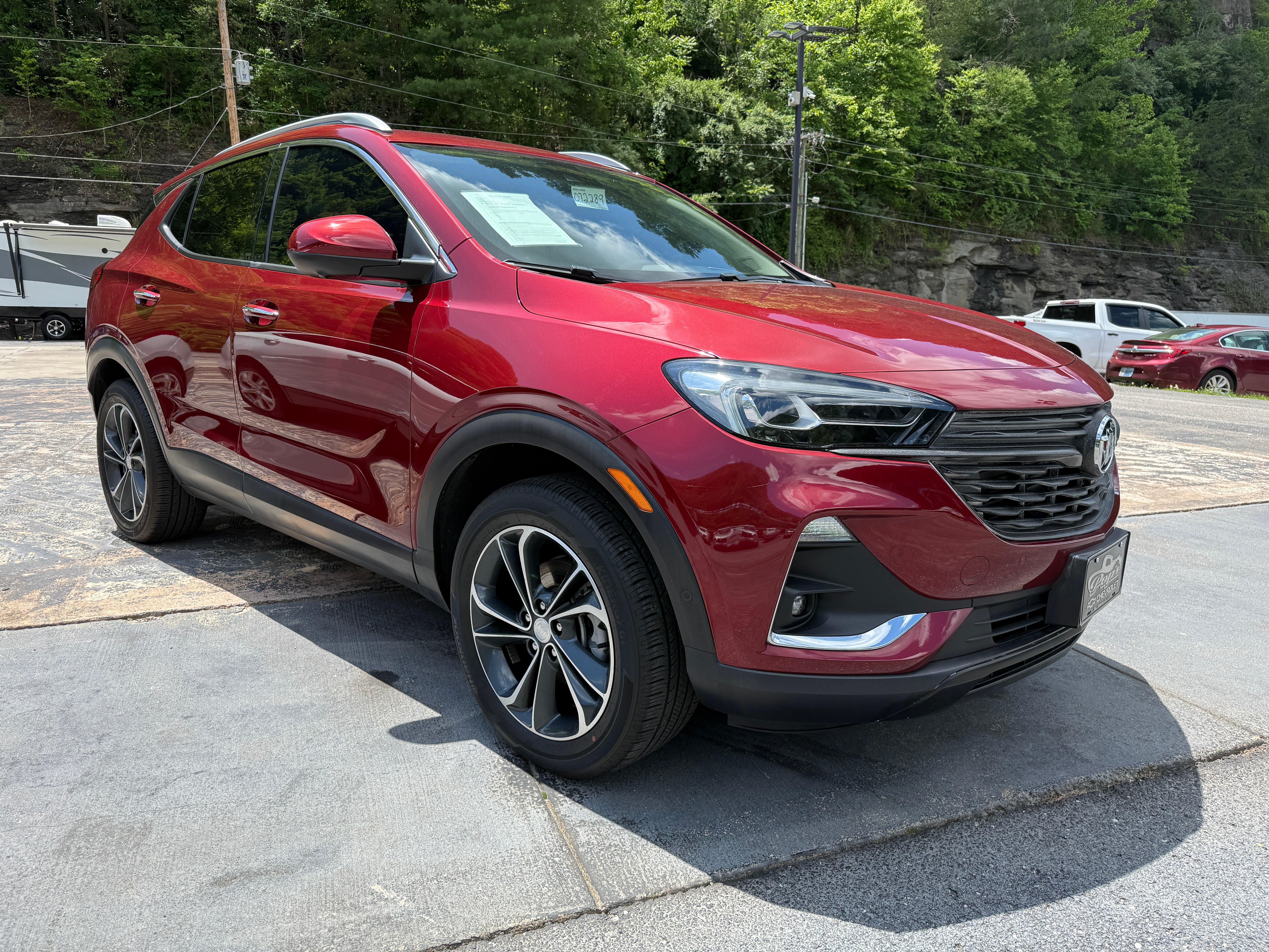 2023 Buick Encore GX Essence in Cinnabar Metallic — front three-quarter view