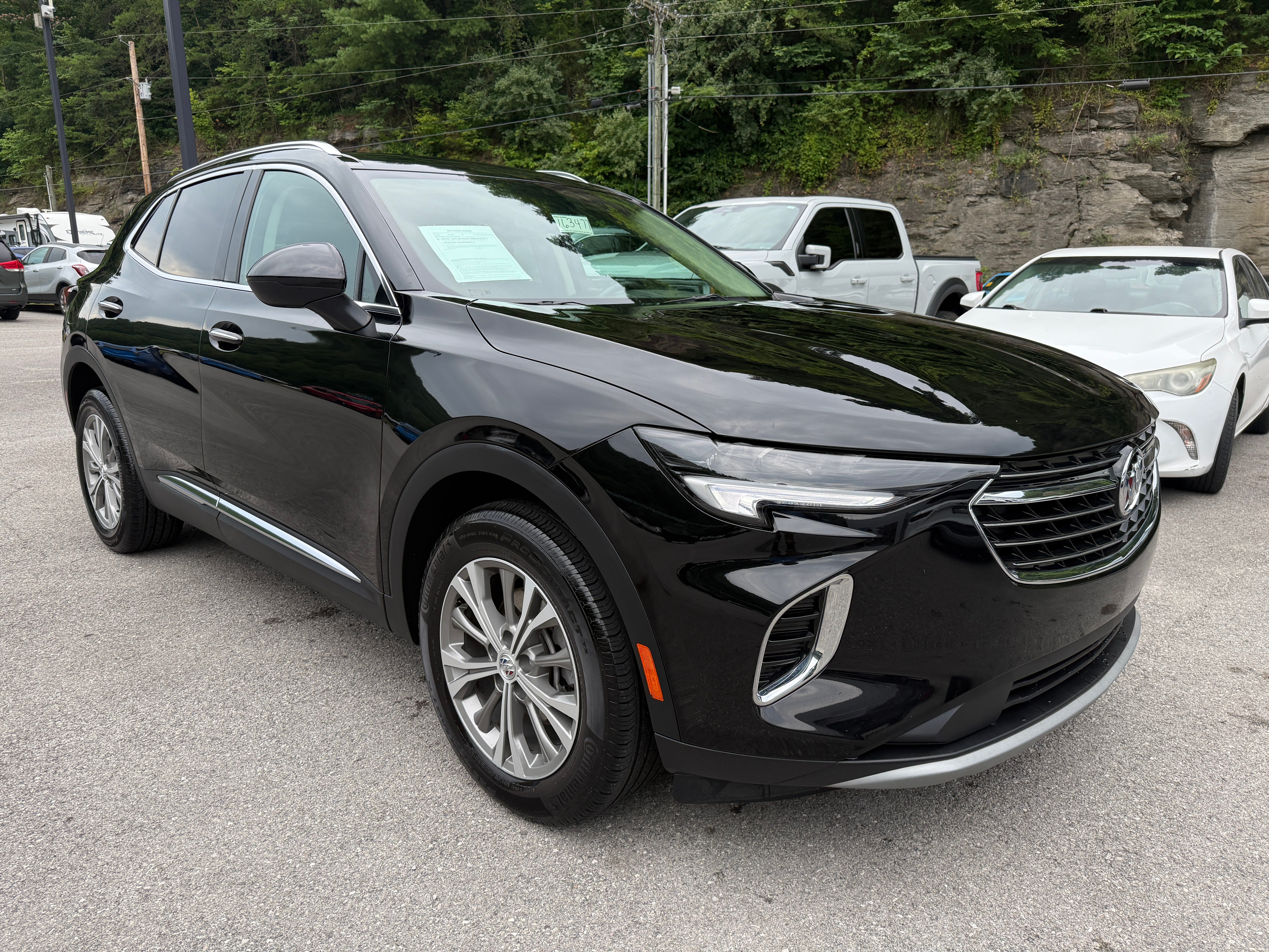2023 Buick Envision Preferred in Ebony Twilight Metallic — front three-quarter view